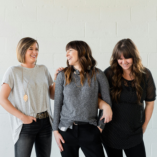 Three women laughing